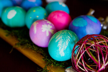 Vibrant Collection of Hand-Painted Easter Eggs on Wooden Surface
