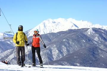 a group of friends skiing in the mountains lifestyle outdoor winter