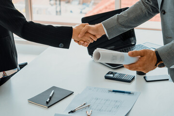 Businessman executive handshake with businesswoman worker in modern workplace office. People corporate business deals concept. uds - obrazy, fototapety, plakaty