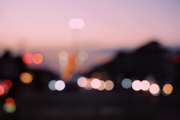 Colorful defocused bokeh abstract background created by city night lights. Blurred defocused...