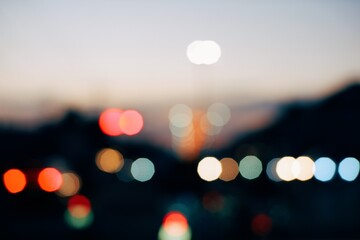 Colorful defocused bokeh abstract background created by city night lights. Blurred defocused...