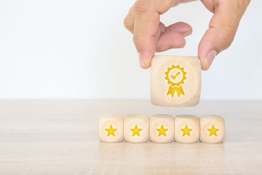 Emoticon smile face on cube wooden block stack for customer services rating feedback satisfaction survey business review and exchanges development for service mind and marketing plan management.