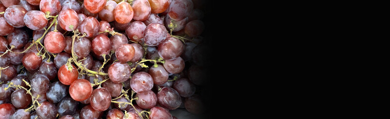 Close up of raw organic sweet red grapes background, wine grapes texture, Healthy fruits Red wine...
