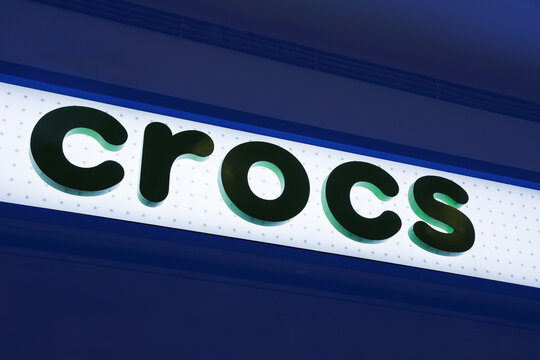 Store sign at the entrance to a retail store Crocs