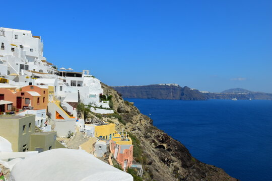 June 18, 2023: Ferry passing the calderea of Fira, Santorini, Cyclades, Greek Islands, Greece, Europe. This was on a sunny day with a clear horizon in this stunning and picture perfect Greek Island.