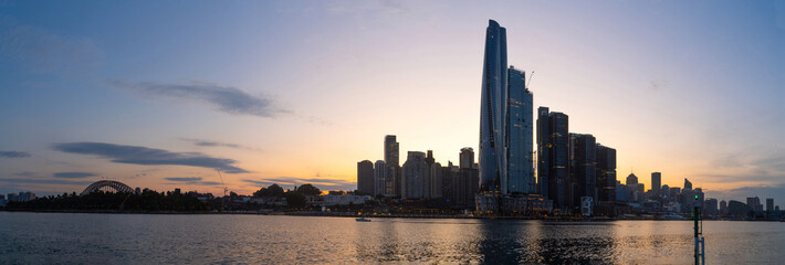 Obraz premium Panoramic view of Barangaroo waterfront precinct in Sydney City, NSW Australia during a morning sunrise in December 2023 