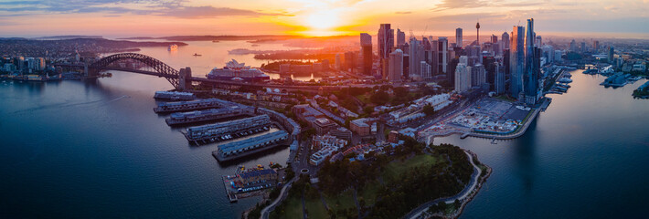 Panoramic view of Sydney Harbour, Sydney City and Barangaroo waterfront precinct in Sydney City, NSW Australia during a morning sunrise in December 2023     