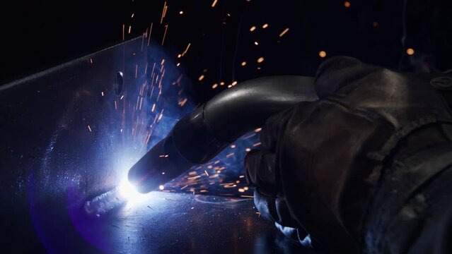 Closeup shot of metal inert gas welding or metal plate carbon steels welding to structure