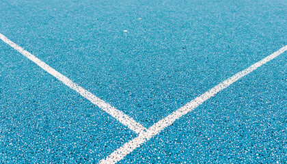 Light blue rubberized and granulated ground surface with white lines