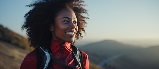 A smiling black woman using futuristic AI technology during an outdoor run for cardiovascular health.