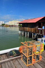 Fototapeta na wymiar Penang, Malaysia - August 10 2023 - Chew Jetty (Clan Jetty) in Penang. Unesco World Heritage Site in Penang, Malaysia. It’s a unique scenic that combines resident home stay with tourism.