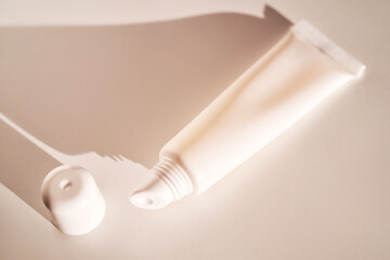 Hygienic moisturizing lip balm in a tube on a white background.