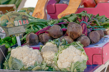 assorted vegetables in a street fruit market, cauliflowers in the foreground