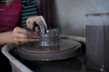 Close up of pottery making process.