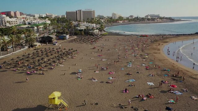 Aerial 4K video from drone to de Tenerife and beachs Adeje Playa de las Americas, Playa Honda,Playa de Troya, Playa de El Bobo.In the background Tenerife at sunset. Tenerife, Canary islands, Spain 