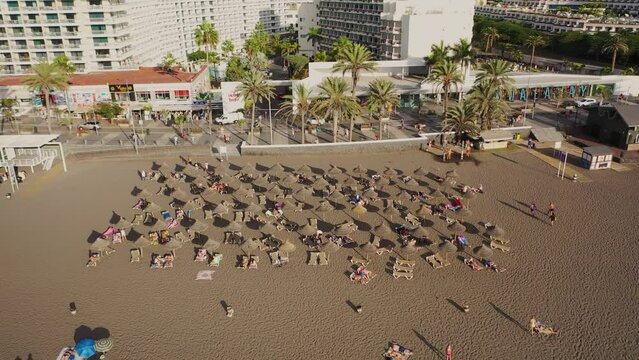 Aerial 4K video from drone to de Tenerife and beachs Adeje Playa de las Americas, Playa Honda,Playa de Troya, Playa de El Bobo.In the background Tenerife at sunset. Tenerife, Canary islands, Spain 