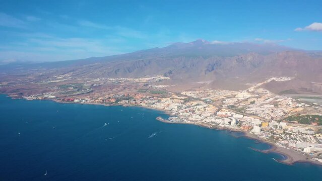 Aerial 4K video from drone to de Tenerife and beachs Adeje Playa de las Americas, Playa Honda,Playa de Troya, Playa de El Bobo.In the background Tenerife at sunset. Tenerife, Canary islands, Spain 