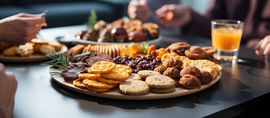 Closeup of people enjoying various snacks near a table during a coffee break. - obrazy, fototapety, plakaty