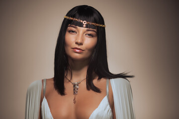 Photo of gorgeous woman with Cleopatra makeup, closeup portrait of beautiful female with stylish...