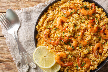 Shrimp risotto is made with fragrant arborio rice sauteed in onions and garlic, simmered stock, and...