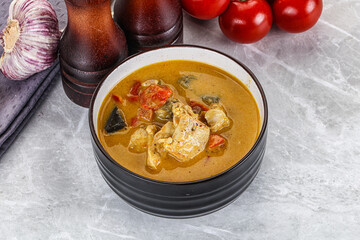 Traditional yellow Thai curry with chicken