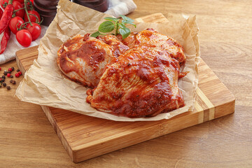 Marinated chicken leg in tomato sauce