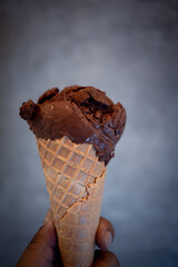 Chocolate ice cream in wafer cone. Close up