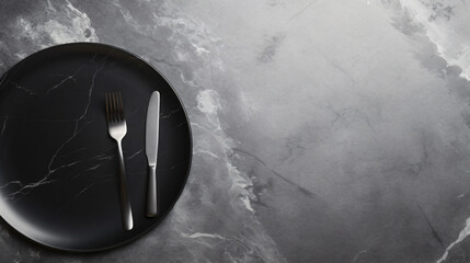 Black plate with cutlery on white stone table. Top view - obrazy, fototapety, plakaty
