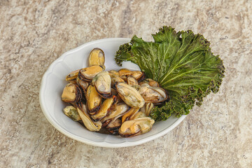 Tasty marinated mussels in the bowl