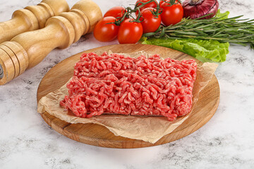 Raw minced beef meat on cutting board