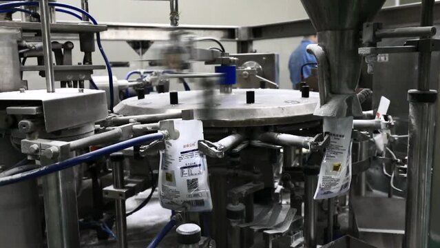 Machinery and equipment in normal operation in a salt packaging production line, North China