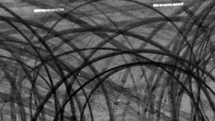 Zelfklevend Fotobehang Aerial top view car tire marks burnout, Tire marks on the asphalt road, Tire mark on race track texture and background. © Darunrat