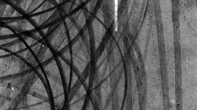Aerial top view car tire marks burnout, Tire marks on the asphalt road, Tire mark on race track texture and background.
