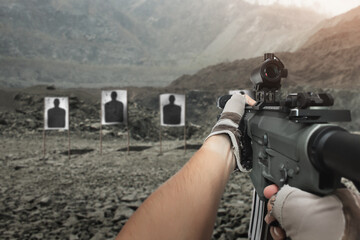 Assault rifle red dot target view, image of a rifle scope sight used for aiming with a assault...