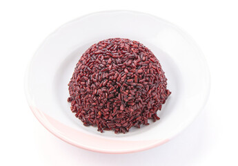 Cooked riceberry in a white plate isolated on white background. Riceberry rice is dark purple rice similar to ripe berries, rich in nutrients and has good anti-oxidant properties.