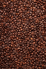 Top view of roasted coffee beans background on flat lay in vertical, surface, texture, Roasted coffee beans is a fruit from the Coffee plant. This fruit is often referred to as a coffee cherry.
