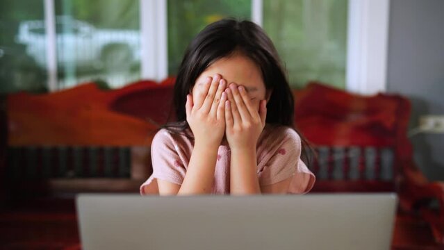 Disappointed girl reacts to video game setback