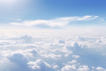 Panoramic morning landscape with vast sky and fluffy clouds seen from a plane.