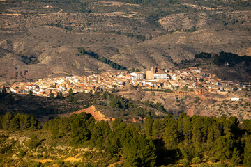 Fototapeta na wymiar Panoramic view from the distance of the village of Teresa de Cofrentes, in Valencia, Spain, in daylight