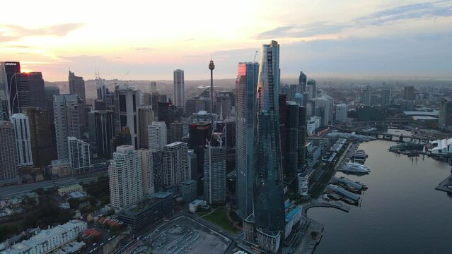 Aerial drone rotation view of Barangaroo waterfront precinct in Sydney City, NSW Australia during a morning sunrise in December 2023