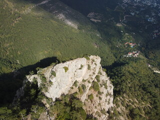 Aerial panoramic view of forest on rocky mountain slope - Ai Petri, Yalta, Crimea. Abstract aerial nature forest and mountains. Weather and Climate Change. Vacation, travel and holiday concept