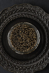 black caviar on a black background
