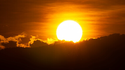 Time lapse of a beautiful nature morning with orange, yellow sunshine and fluffy clouds. Beautiful colorful dramatic sky with clouds at sunset or sunrise.