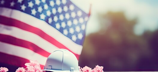 Happy labor day, american flag, labor helmet, and flower composition with copy space for text.