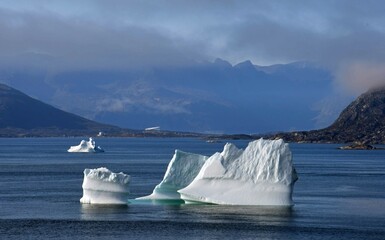 close up of icebergs and  mountain peaks,  near nanortalik near tasermiut fjord  in southern...