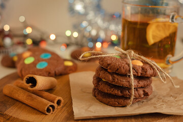 Snack on sweet homemade cookies with round sweets and tea with lemon. Fun baking for the Christmas...