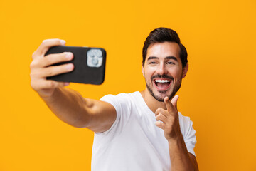 Phone man mobile smiling copy portrait smartphone cyberspace happy phone communication yellow space