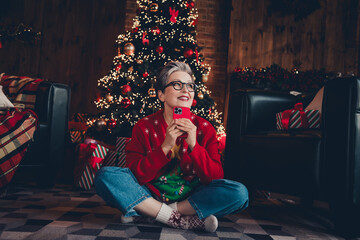 Full length photo of retired lady use cell phone looking dreaming at home prepared for holly xmas...