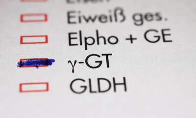 Viersen, Germany - May 9. 2023: Closeup of lab sheet for medical diagnostics Gamma-GT blood test