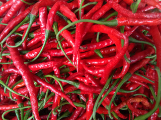 Red hot chili peppers pattern texture background. Street vegetable market. Group of Red hot chili...